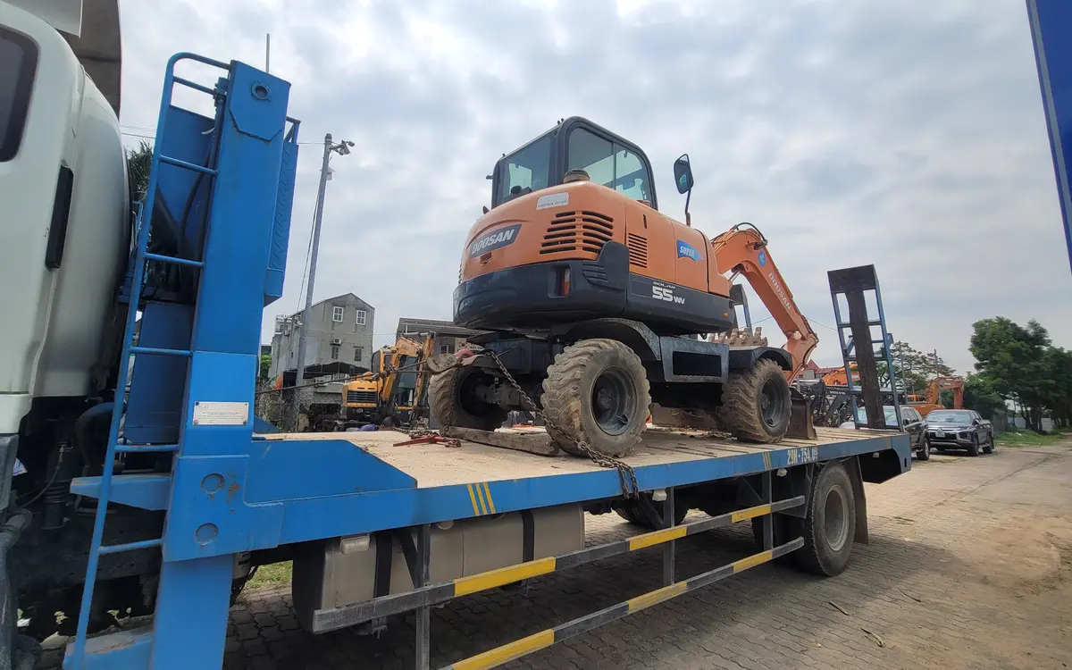 Wheel excavator being transported locally in Vietnam